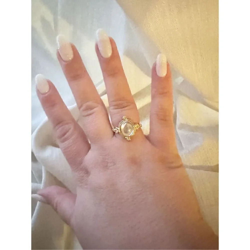 Size 8 oval cut iridescent ring